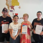 Students holding their course certificates