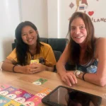 A teacher and student practicing Thai